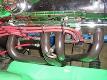 Pass side headers and valve cover
