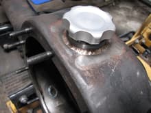 Got one of those housings with no fill or drain plugs in it, so I made my own. I never liked filling a differential from the side, with a squeeze bottle.