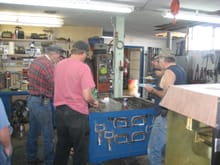 Everyone bellied up to Don's continuing welding/fab bench. The conversation was paused for some serious eating. Left to right
Don, Craig, Jim, and Chris.
