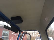 Stock headliner from Dennis Carpenter installed; cut hole in head liner for access to wiring when stereo is pulled from console