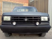 BEFORE: smoked turn signals painted bumper and grill installed fog lights