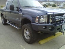 2007 F350 SD SRW, 4X4 Front left view of leveling kit (3&quot; Rough Country) and the Buckstop Bumper with 12K Smittybilt Winch.