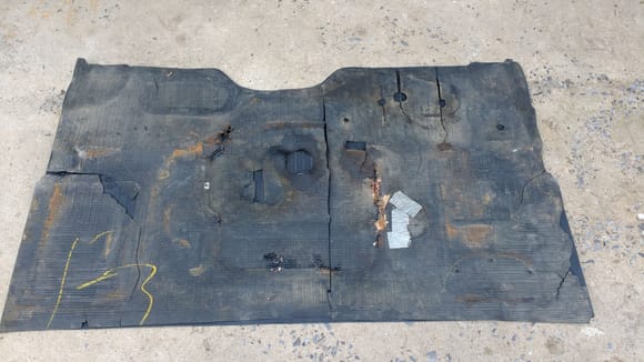 This is my old mat lying on top of the new, upside down. Notice the chalk mark that says F3, but why I thought. the mats are all the same for all models. But correct holes must be all ready punched out at the line before it goes in, I guess.