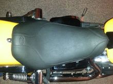 Sorry about the picture quality.  Just put the seat on.  It's very comfortable parked! Lol
I'm 6'2"" and it definitely drops you back and down a noticeable bit. The actual surface area is about the same as the stock seat. If the temp gets above 30 this weekend, I may go for a quick ride.