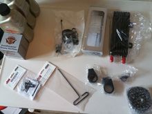 oil cooler, adapter w/ thermostat, anti-rotate device, mounting clamps, and tool