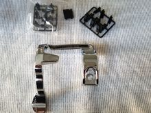 The product seems to be a very sturdy plactic that is pretty solid.  This also comes with spacers for fitment (if needed) as well as button sensitivity.  I did not use any spacers. 