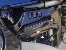 DVR mounted on outside face of switch console with automotive high strength double stick tape.
