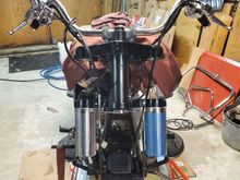 Triple trees with cowbells and handlebars installed.