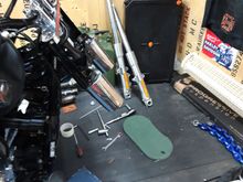 Pinch bolts out and remove the fork nuts and the whole fork legs come out!