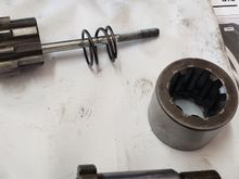 This side towards the jackshaft head bolt (retaining ring towads the left outside of the bike?)
