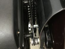 The threaded coupling is screwed onto a boltvthat goes through the rear turn signal bolt hole, left open when the signals were relocated.