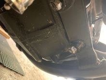 So right underneath the front of bike two screws it’s the one on the right . This is right under the oil filter that doesn’t seem to be leaking at all