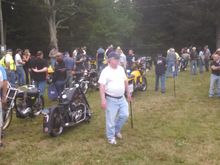 Should have gotten a closer pic..but that flat black bike on the end, Triumph with a touch of old Harley FLH rear end...