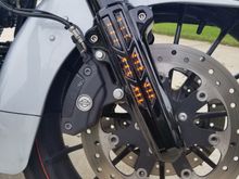Front fork Run-Turn marker lights.  Lot nicer to look at then the ugly stock reflectors.  Very unobtrusive when not lit, but when lit provides good side lighting and turn signal operation that is easily seen from the side.