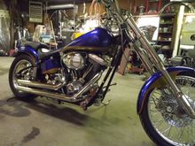 I built this with 2" overs tubes and 5 degree raked trees. Could take my hands off handlebars at any speed,from about 15 mph to 100 mph.
 Bike always handle like it was on rails,but a bit of a handful when parking.