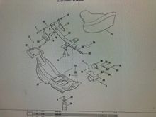 This exploded view shows the two-piece front mount. The later (springed versions) have a one-piece front mount where both sides are connected. The tray under the seat pan is also different. 