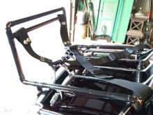 The whole thing is made from copper tubing, reinforced inside on the two bottom corners with some JB Weld inside; all of the straps snap on and off (the cross strap isn't on there yet, but you can see where the snaps are.  The whole thing weighs maybe two pounds, tops.