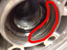 That is the spot where the other half of the bearing race seats. There is metal missing from here. That will HAVE to be fixed or wheel replaced I assume.