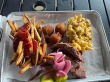 $20 dollars for fries, mac&cheese, brisket, and a drink.
They charge extra for the M&C, and probably the worst I've had.
Portions were small and brisket was fair to middlin