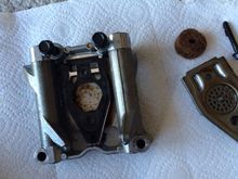 The 2 holes without bolts are where the rocker inserts go.