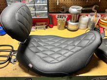 With attached backrest.