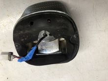 Blue tape is holding extra mounting screw