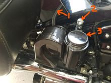 1.  Ran wires down to horn in flex tube.  2. Reinstalled Frame bolt with blue Locktite.  3.  Top of horn was plain metal where I removed the logo sticker.  Painted it Gloss black with Krylon Automotive paint.