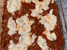 Lasagna layering ricotta/cheese mix