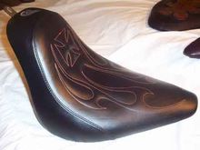 C&amp;C Seats with Maltese Cross and Tribal Stitch Pattern 
http://www.sideroadcycles.com/AmericanMotorcycles/Seats/Motorcycle_Seats.html