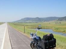 My favorite pic of the bike (so far).  Clear skies and a nice stretch of asphalt.  What more does a rider need?