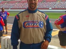 Me after doing 170mph around Lowes Motor Speedway in an honest race car.  WHAT A RUSH! (in case the smile doesn't give it away).  I rode my bike up there and after the whole thing was over, I asked if I could take the wide glide for a lap.  They said no.  I HAD to ask. :)
