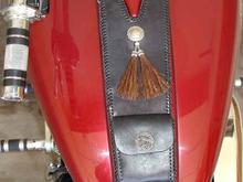 Another view of the tank bib. The concho is sterling silver with 2 horsehair tassels. The Phoenix Bird pouch snap is sterling also and is from Bangkok Thailand