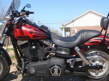 DSC01713 Harley FaBob sissy bar, Asshole mirrors from J&amp;P CYCLES. Fuse Box Trim,I ordered 2 battery box trim pieces off of a 2010 CVO FatBob put 1 on battery box and trimmed and rebent the other one to fit the fuse box cover it was a pain in the ass but i got it to fit and it looks nice even up close.