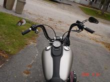 Black ape hangers, nostalgic grips, demons cycle mirrors (kick ass!) and black levers.