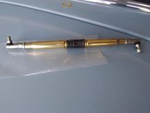 Military theme shift linkage. Two .50Cal rounds separated by an M16 flash suppressor.