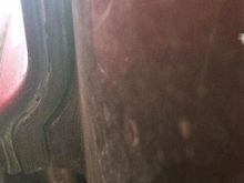 Picture was taken with camera on the floor, from underneath, looking up at the trunk. The far left is the fiberglass shell, then the "steel frame" which goes under and up (a little) the fender. the left side rear fender would be to the left, but is not in the picture. 