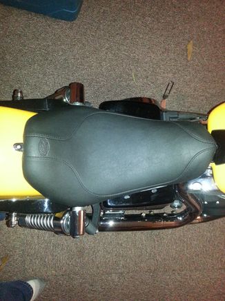 Sorry about the picture quality.  Just put the seat on.  It's very comfortable parked! Lol
I'm 6'2"" and it definitely drops you back and down a noticeable bit. The actual surface area is about the same as the stock seat. If the temp gets above 30 this weekend, I may go for a quick ride.