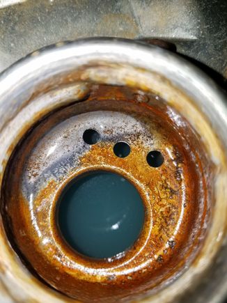 First view after letting it stew for 3 hours. I can tell that it's working based in the small part of raw steel in the filler neck.