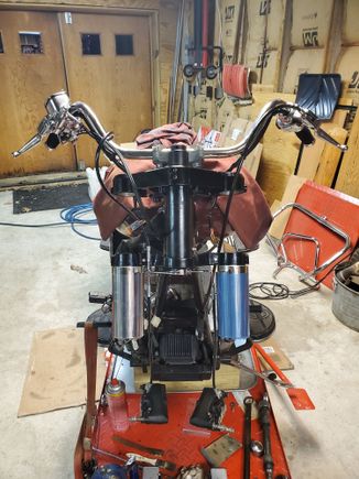 Triple trees with cowbells and handlebars installed.