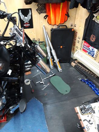 Pinch bolts out and remove the fork nuts and the whole fork legs come out!