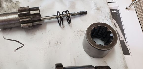 This side towards the jackshaft head bolt (retaining ring towads the left outside of the bike?)
