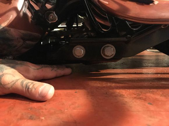 This is what I’m trying to solve.  Towards the back bolt in the pic it’s about 3/4”.  Just want it to lay flat.  The guy that did my swingarm made a miscalculation and now isn’t returning my calls.  Easiest fix is a tire swap.