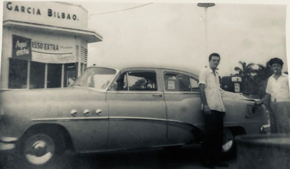 My dad with his 52 Buick Special at a full service gas station. 11/12/ 1953