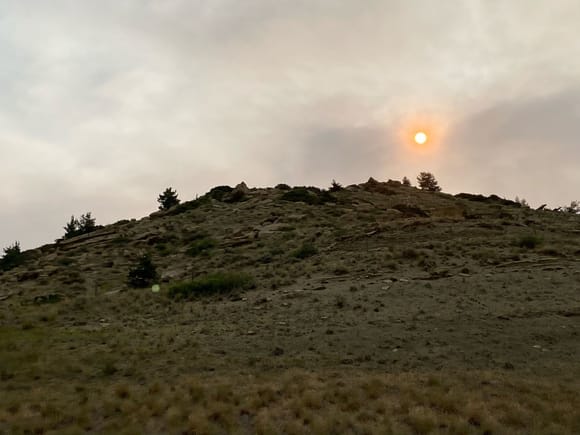 Fires in Montana have smoke in the air, Sun looks red at dawn.
