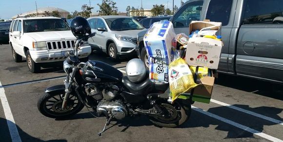 2007 XL1200L Just a little shopping at Costco. When I pushed my full cart up to my motorcycle, I overheard two guys saying that there was no way that I could get all my stuff on my motorcycle. I bet them each $10.00 and I made an easy $20.00 on that bet.  ;^)