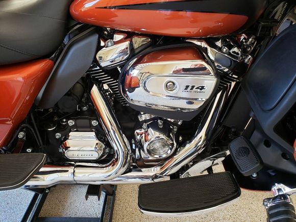 New HD air cleaner but the original simply had the dust blown out. No oil in the filter and only a very thin film of oil in the intake during the 10k service.