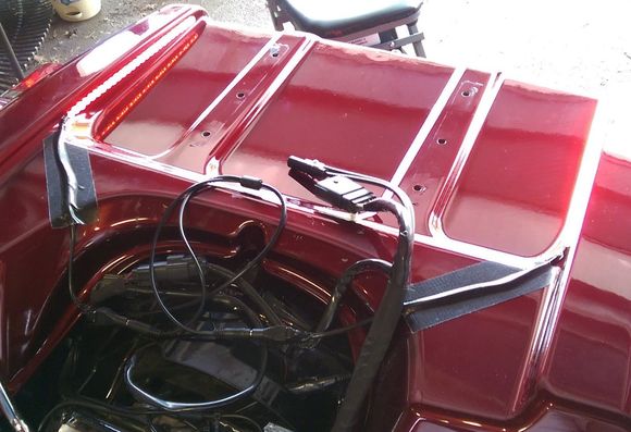 These are side-firing LEDs, so they aren't seen from anywhere but directly behind, but they point UP towards the tour pack, which reflects them as a bunch of little bright dots on it; but when you look, there aren't any lights there!