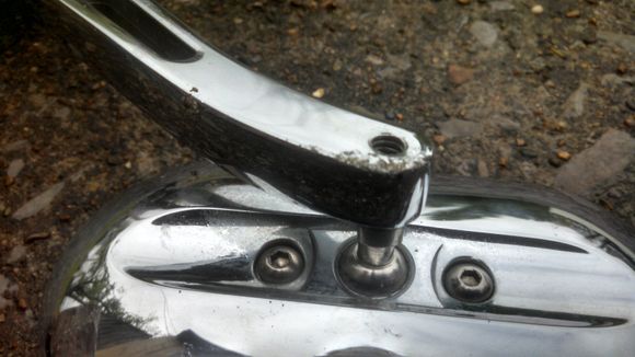 Damaged when I got it. The box was not damaged so I assume it was shipped this way. These are chromed mirrors...not billet as advertised. The chrome is rough too. This is AFTER being washed with soap, water and a soft cloth and then wiped with windex