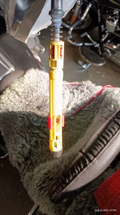 Old cable. Note much smaller adjustment spring. Also note I installed the lower installation red clip from the new cable. This keeps the connector from pulling out (when the adjustment clip is out / not engaged).