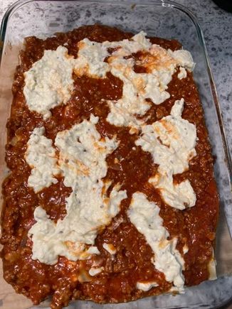 Lasagna layering ricotta/cheese mix